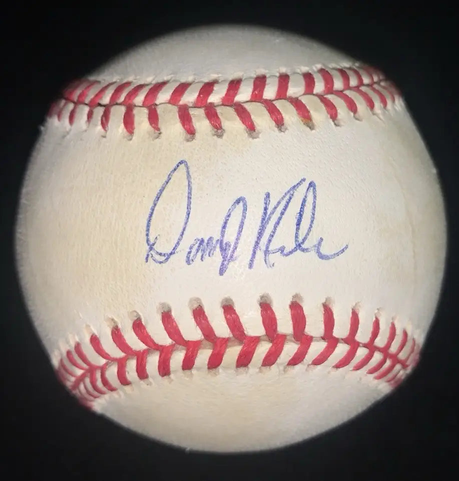 White baseball with red stitching and purple Darryl Kile autograph, Houston Astros memorabilia