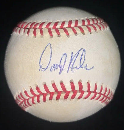 White baseball with red stitching and purple Darryl Kile autograph, Houston Astros memorabilia