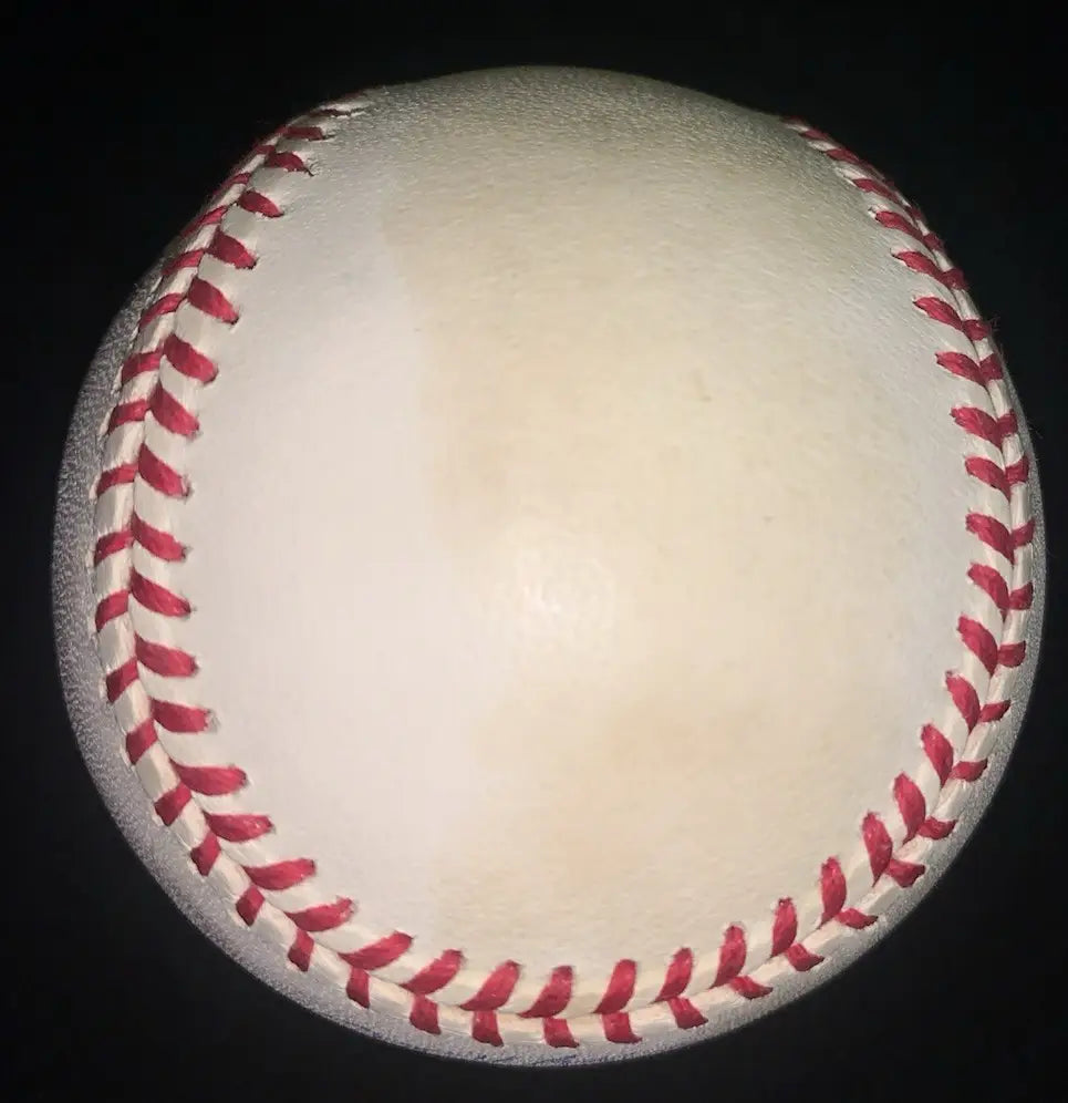 White baseball with red stitching signed by Darryl Kile of the Houston Astros