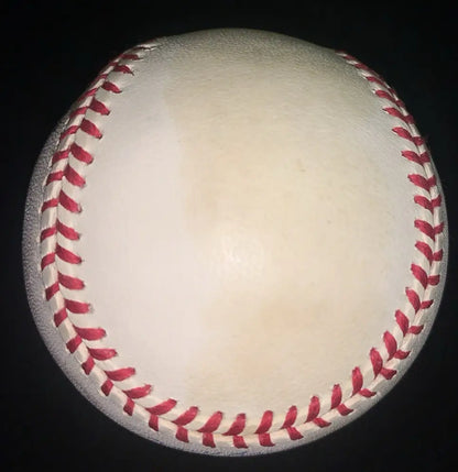 White baseball with red stitching signed by Darryl Kile of the Houston Astros