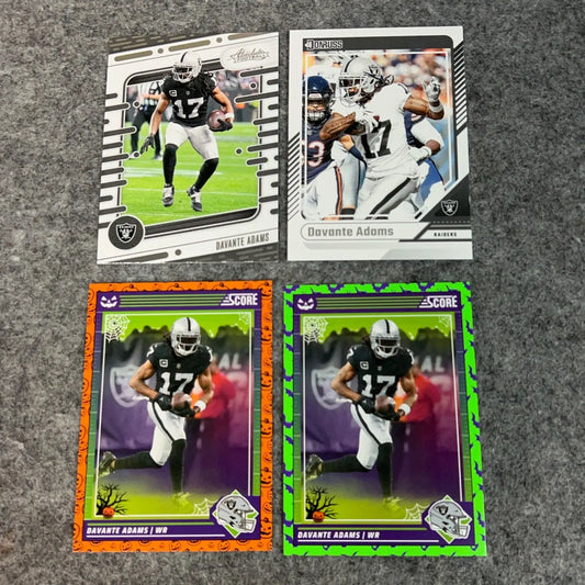 Four Davante Adams Las Vegas Raiders football trading cards for 2024 NFL sports collection