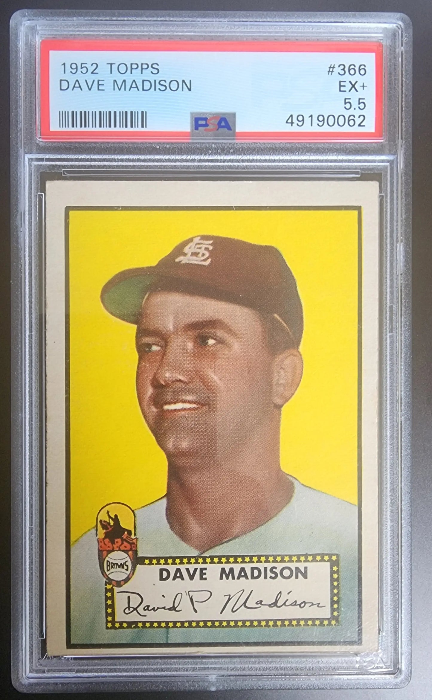 PSA-graded 1952 Topps Dave Madison baseball card with a dark cap and yellow background