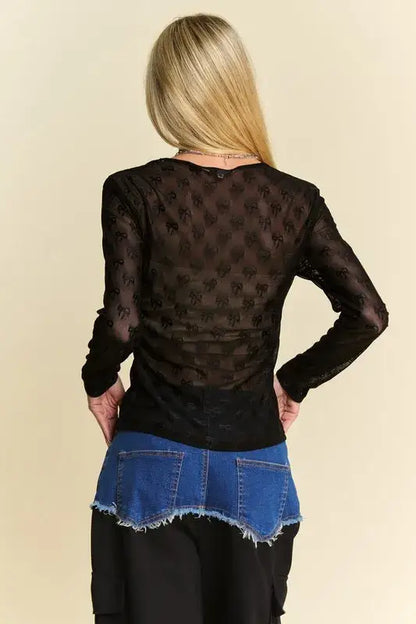 Black lace mesh round neck long sleeve top with bow detail and button closure at back