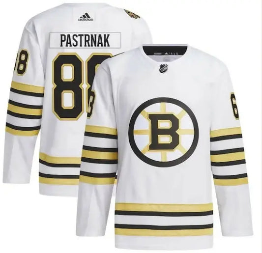 White Boston Bruins hockey jersey featuring David Pastrnak on the front and Adidas Primegreen branding