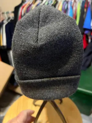 Dark gray knitted Batman beanie hat with folded brim, perfect for Batman beanie fans