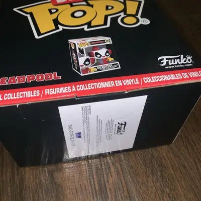 Funko Pop Deadpool box in display box of Deadpool Bitty Pop mystery blind bag vinyl figures