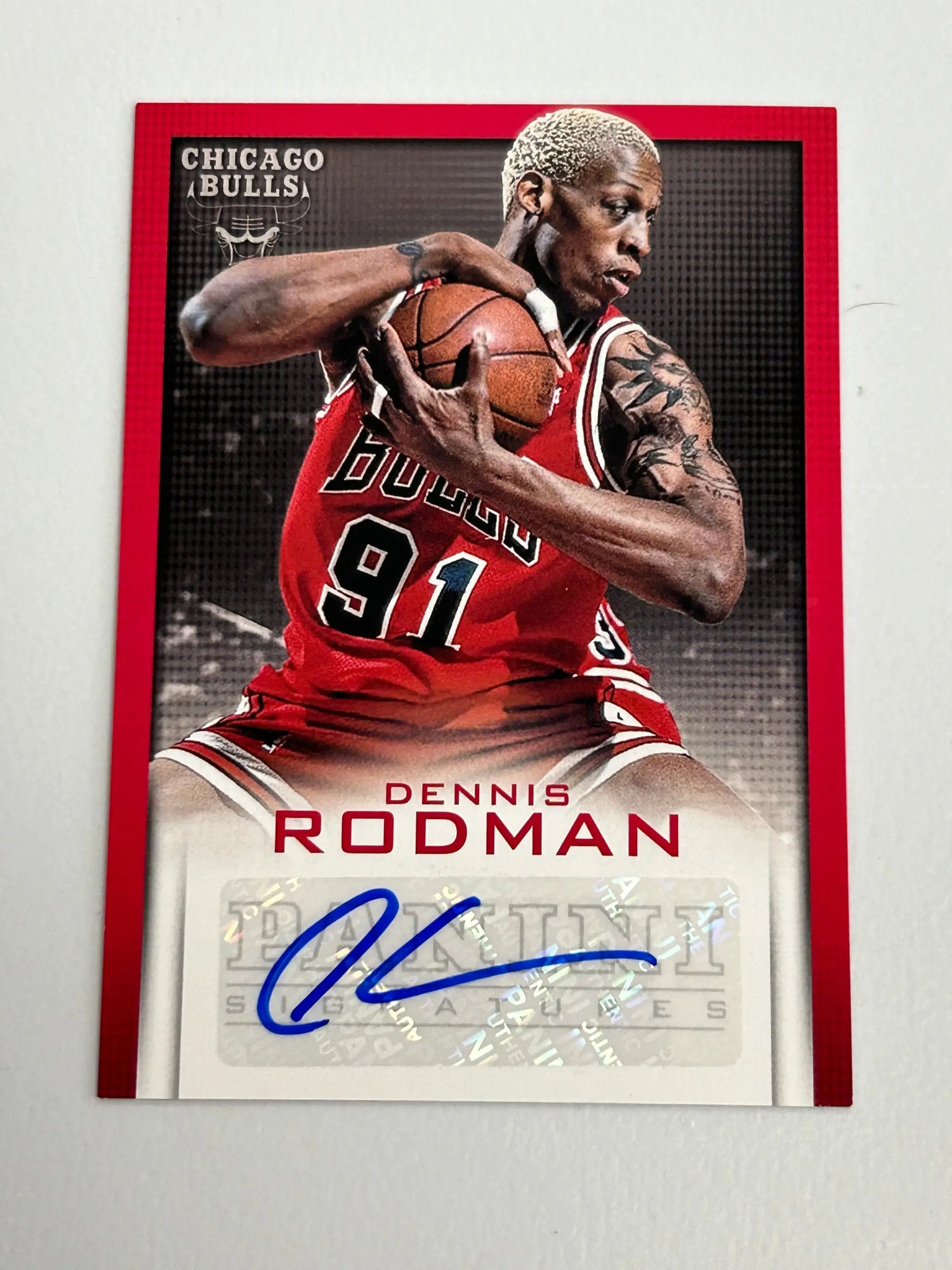 Signed Dennis Rodman Panini Autograph basketball card in red Bulls uniform number 91