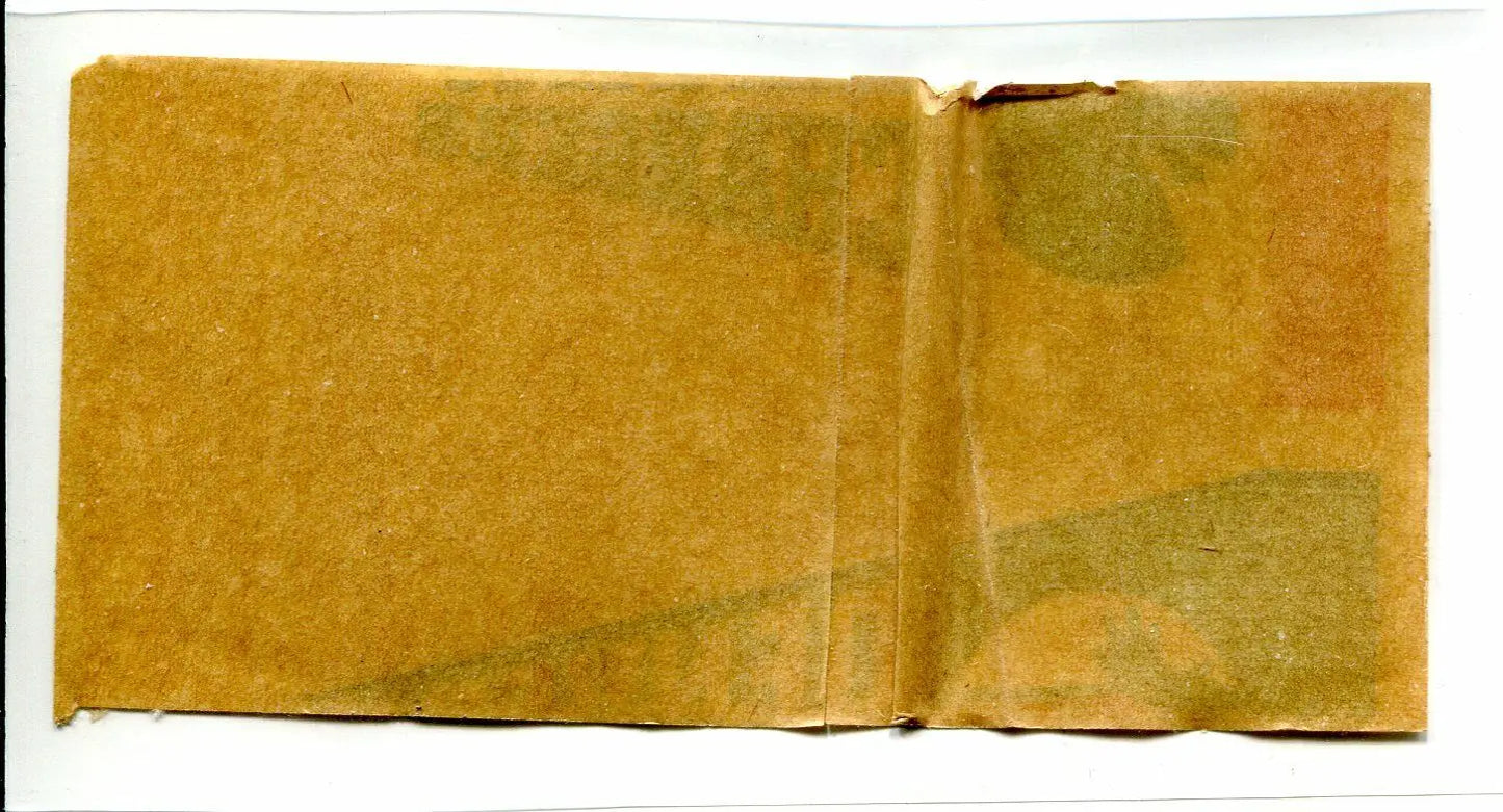 Folded aged paper showcasing a Denver Broncos pennant sticker decal from 1964 Topps AFL