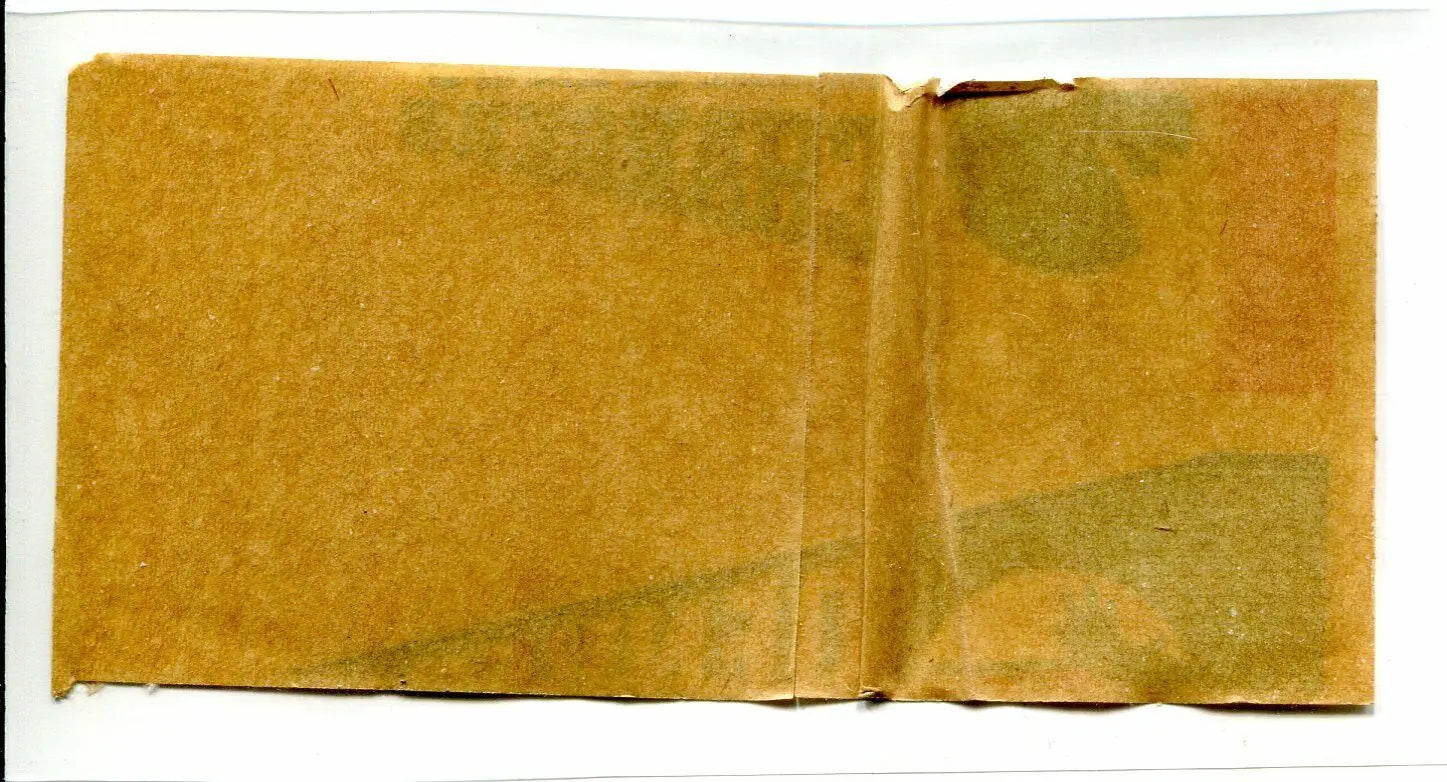 Folded aged paper showcasing a Denver Broncos pennant sticker decal from 1964 Topps AFL