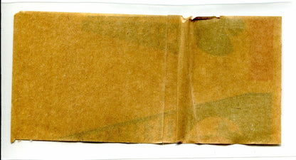 Folded aged paper showcasing a Denver Broncos pennant sticker decal from 1964 Topps AFL