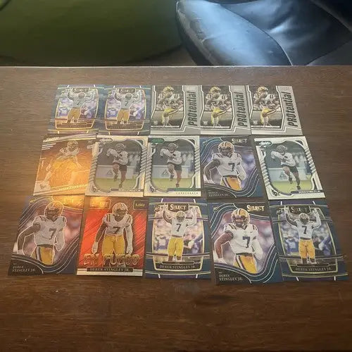 Sports trading cards featuring Derek Stingley Jr in a yellow and purple uniform