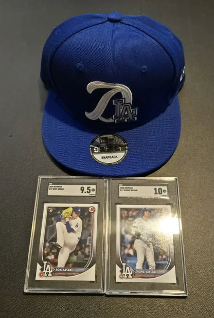 Blue Los Angeles Dodgers cap with graded Roki Sasaki and baseball cards, Era 9FIFTY snapback