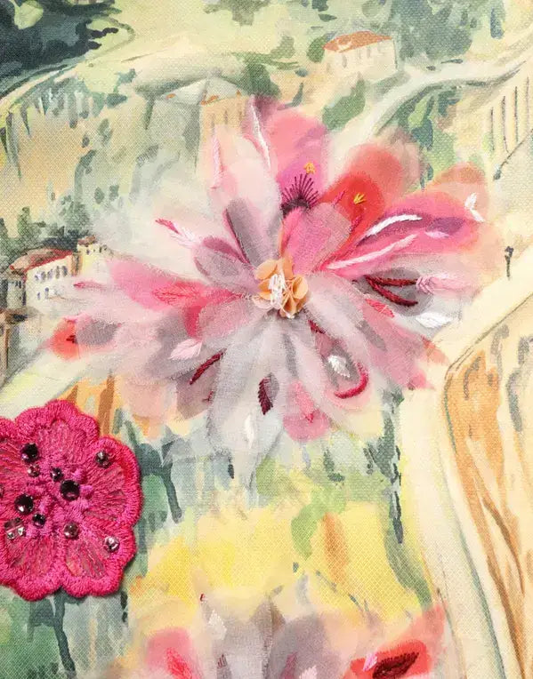 Decorative fabric brooch with pink and white petals and beaded center on DOLCE & GABBANA mini dress