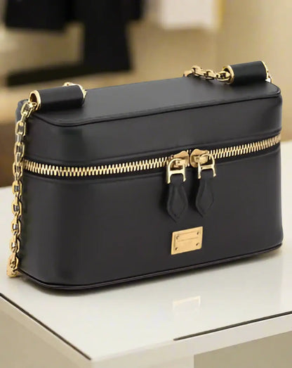 Dolce & Gabbana black leather Sicily shoulder bag with gold chain strap and emblem