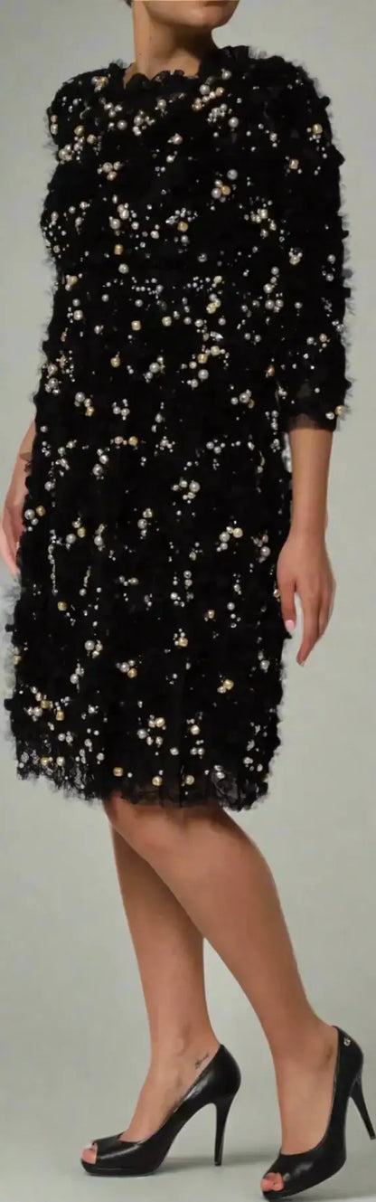 Gabbana black shift dress with pearl embellishments and ruffled texture paired with black peep-toe heels