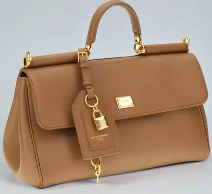 Brown leather Sicily handbag with gold hardware and detachable lock charm in Gabbana butterscotch leather