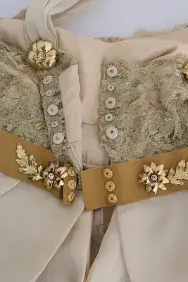 Crystal embellished cream-colored dress with gold silk and ornamental buttons by Dolce & Gabbana