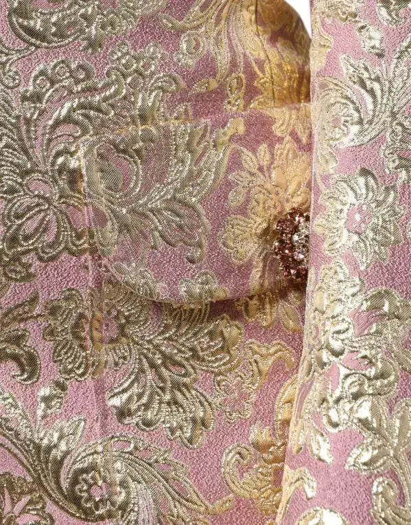 Metallic pink and gold damask fabric with sparkling jewel button on Dolce & Gabbana coat
