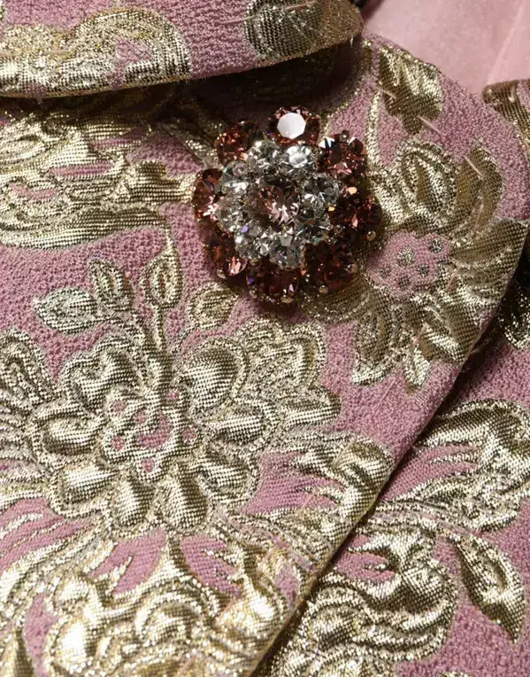 Pink and gold brocade fabric with sparkling brooch on Dolce & Gabbana metallic pink coat
