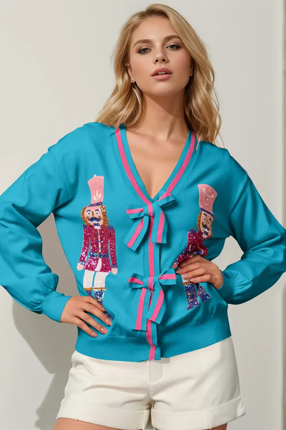 Double Take Full Size Nutcracker Sequin Bow Decor Cardigan - Cerulean / S/M - Apparel & Accessories > Clothing > Shirts