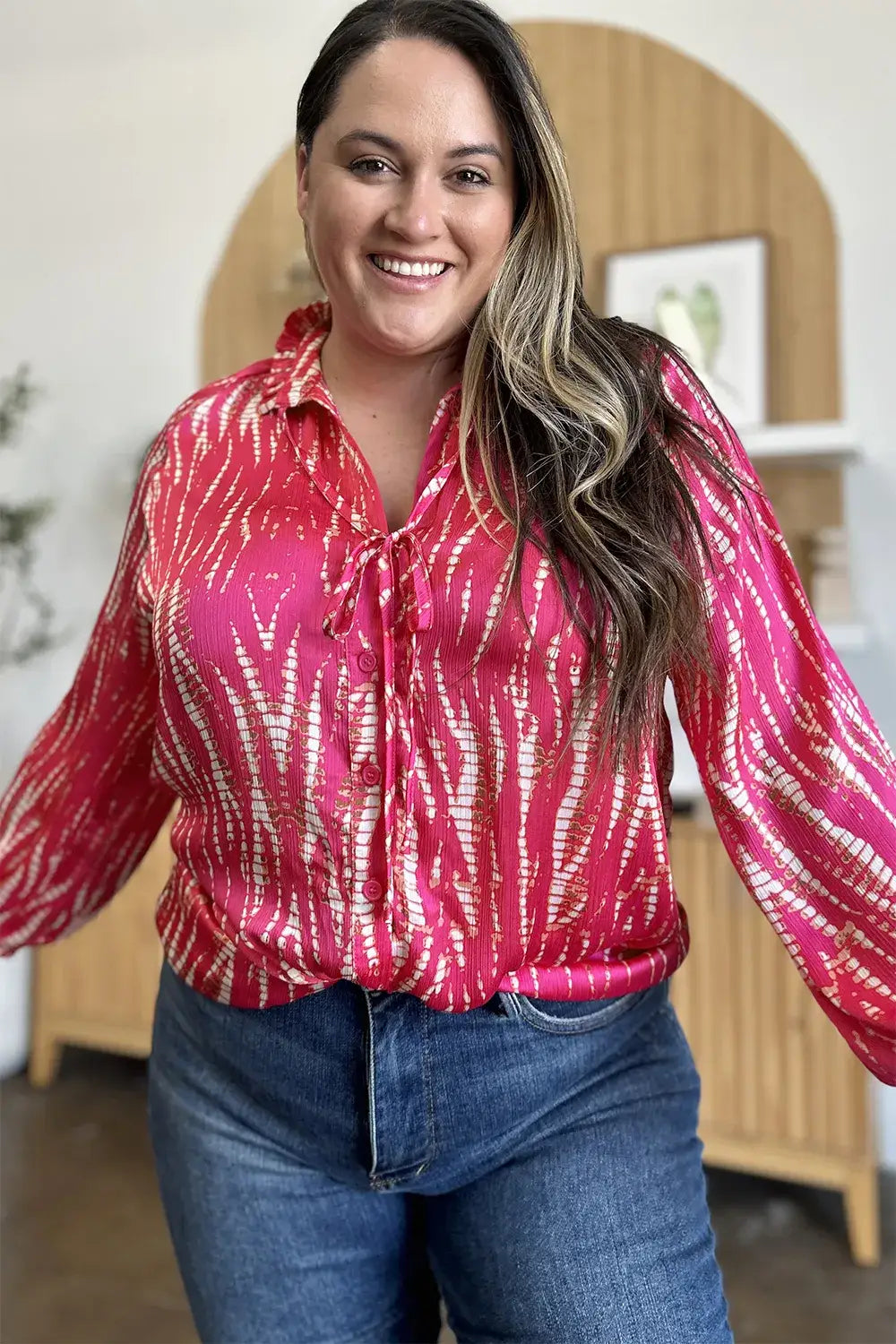 Pink and white tie-dye long sleeve shirt with bell sleeves and printed button details