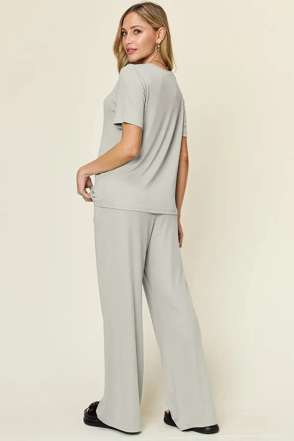 Light gray oversized T-shirt with wide leg pants set featuring relaxed fit and pocket detail