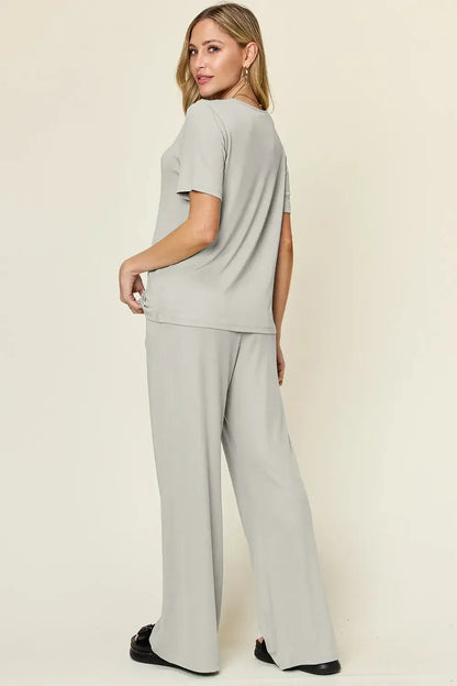 Light gray oversized T-shirt with wide leg pants set featuring relaxed fit and pocket detail