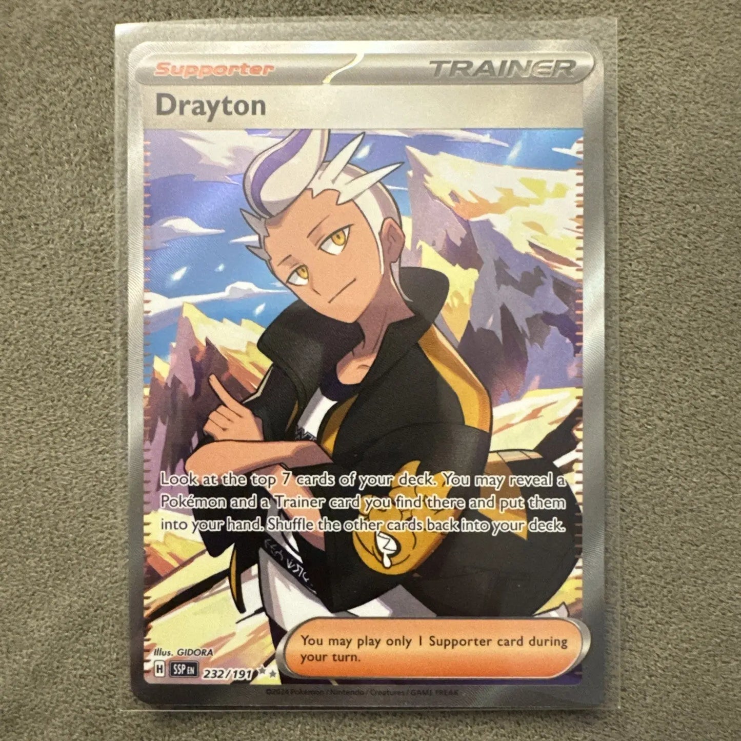 Full art holographic Pokémon TCG Supporter trainer card featuring Drayton from Surging Sparks