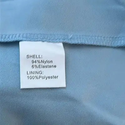 Garment care label on Dress Tells baby blue sleeveless dress for easy maintenance