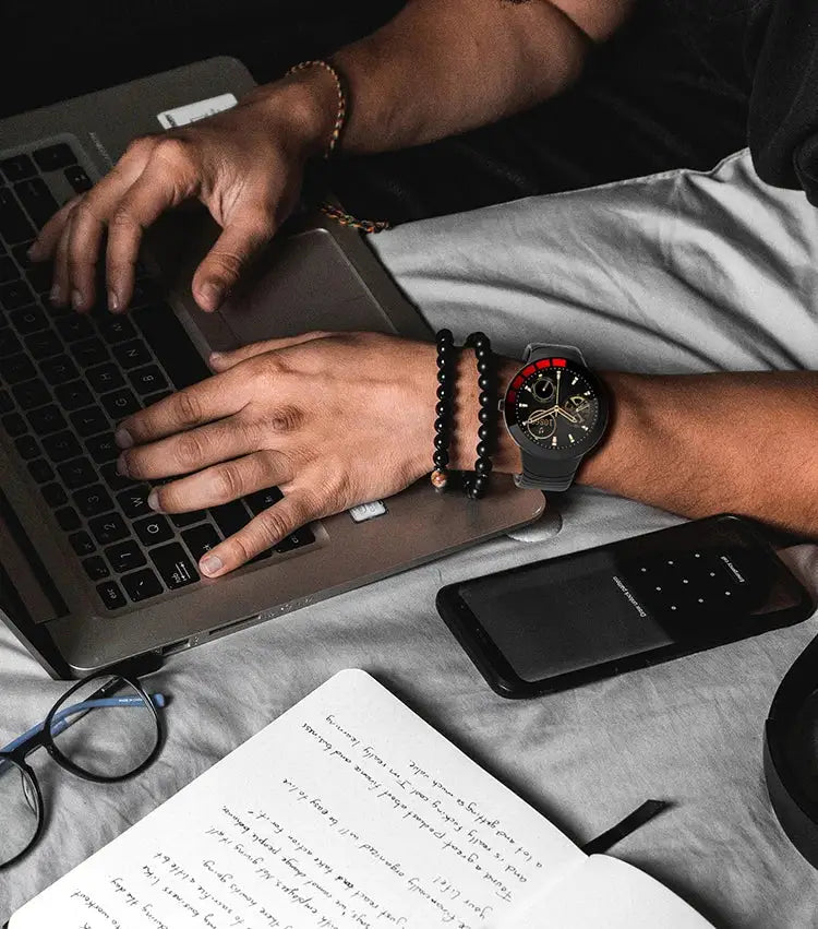 Hands typing on E3 BT Bracelet Health Monitoring Waterproof Smartwatch for business days