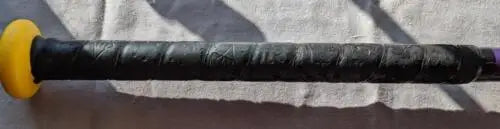 Worn black handle with yellow end of Easton Octane League Baseball Bat Youth 30/18