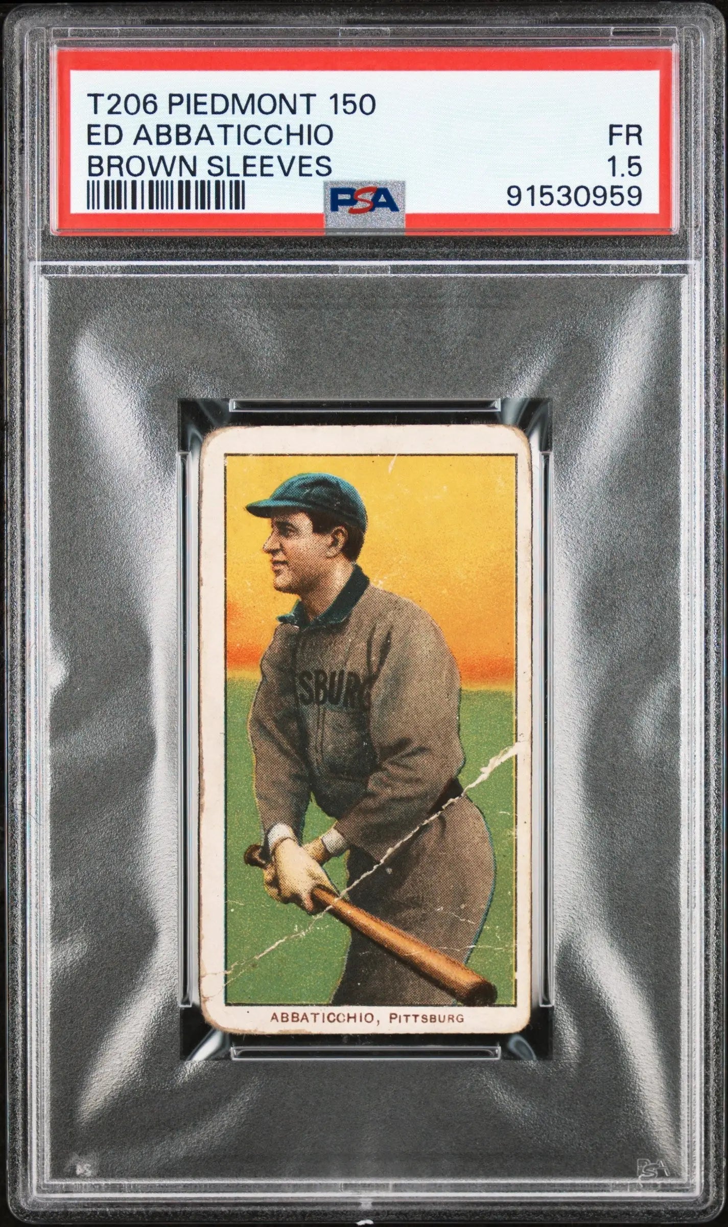 PSA-graded Ed Abbaticcho Brown Sleeves 1909-11 T206 baseball card on yellow-orange backdrop