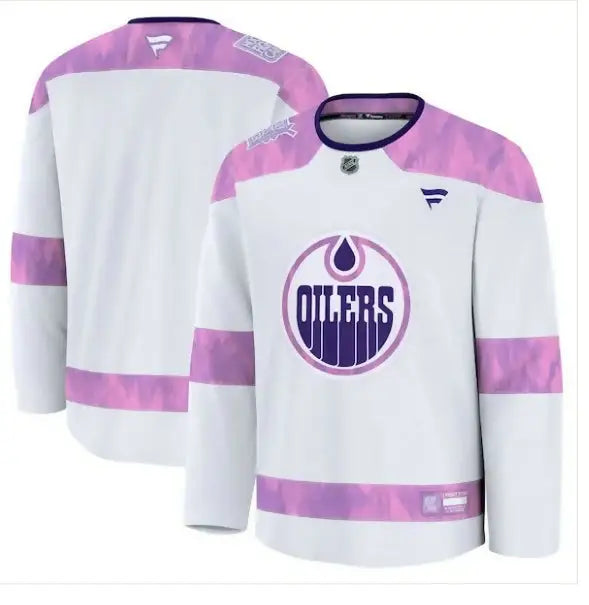 White and pink Edmonton Oilers 2024 Hockey Fights Cancer Practice Jersey displayed