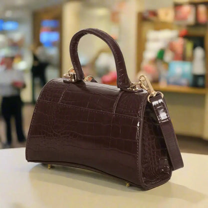 Dark brown crocodile-embossed leather top-handle handbag with detachable shoulder strap