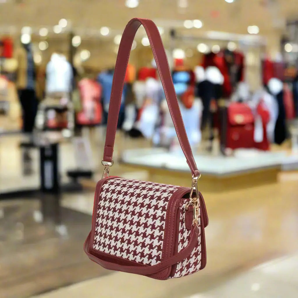 Red and white houndstooth pattern shoulder bag with maroon strap from Egon Von Furstenberg