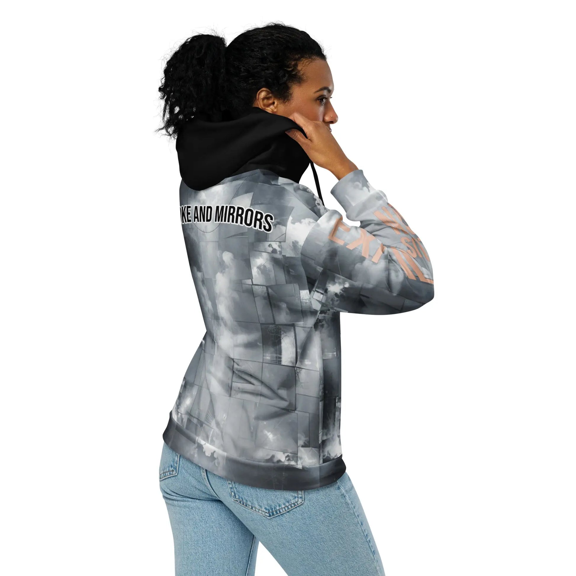 Gray tie-dye exit illusion hoodie with black hood and light-wash blue jeans