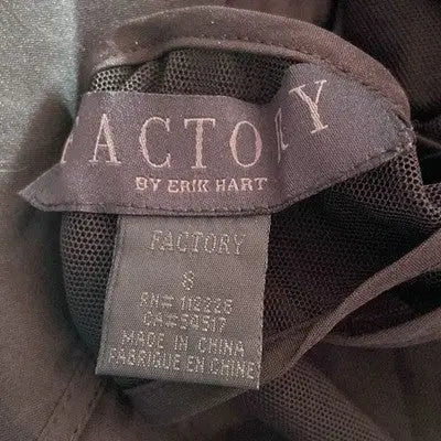Dark gray clothing tag with brand and care info for Erik Hart black dress size 8