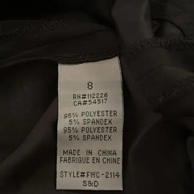Clothing tag with size material and manufacturing info for Erik Hart black dress size 8