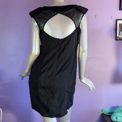Black dress size 8 by Erik Hart featuring a sleeveless mini design with cutout back