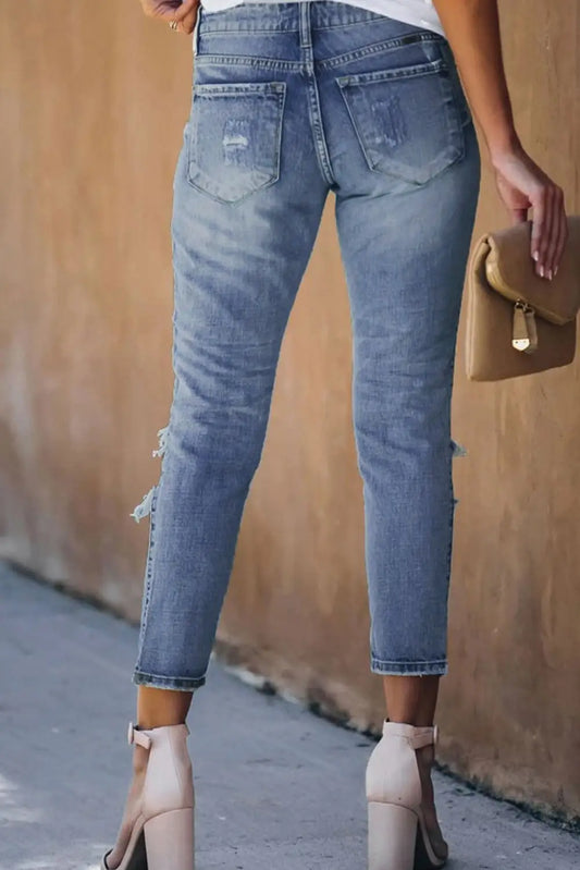 Light blue fading distressed holes women’s crop jeans with high waist and ankle cuffs