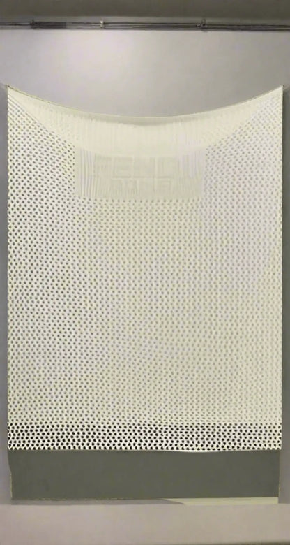 White perforated fabric wall display for FENDI Logo Embossed Lacy Dress