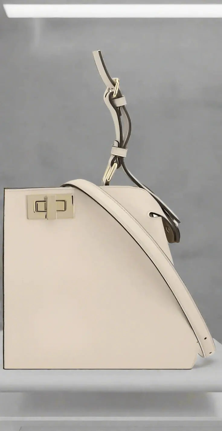Cream-colored FENDI PEEKABOO LEATHER HANDBAG with top handle and metallic clasp closure