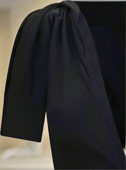 FERRAGAMO black asymmetrical knit dress with black short-sleeved top and ruched shoulders