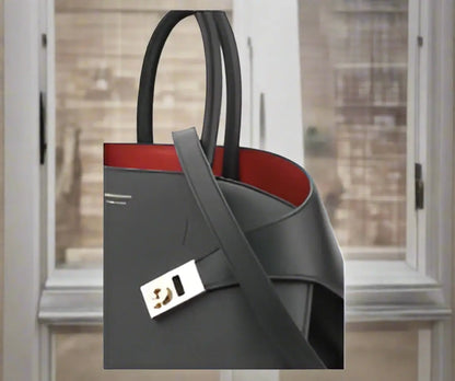 Ferragamo black red hug handbag with black leather, red interior, and gold hardware