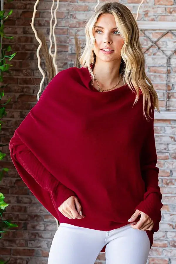 Merlot-colored oversized sweater with asymmetrical hem and dolman sleeve design