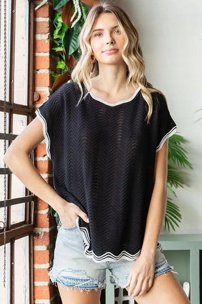 Black and white striped trim knit top with short sleeves featuring wavy crochet drop shoulder design