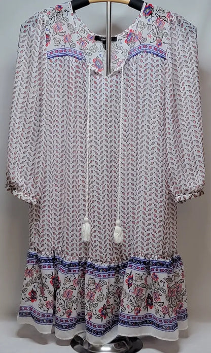White bohemian long sleeve floral mini dress with tiered ruffle hem for stylish summer wear