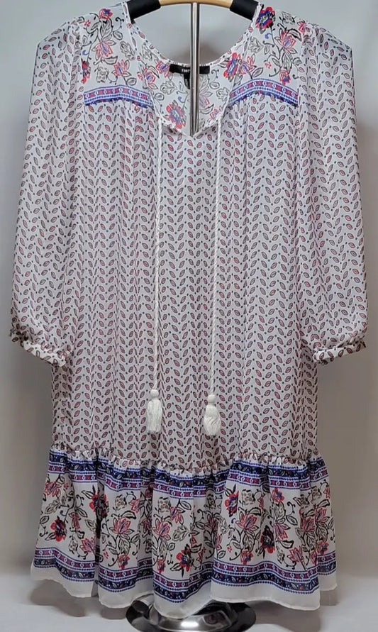 White bohemian long sleeve floral mini dress with tiered ruffle hem for stylish summer wear