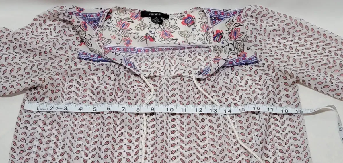 White bohemian long sleeve floral blouse with leaf pattern and floral neckline measurement