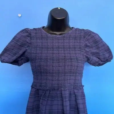 Dark blue plaid dress with puff sleeves and smocked bodice from Free Assembly